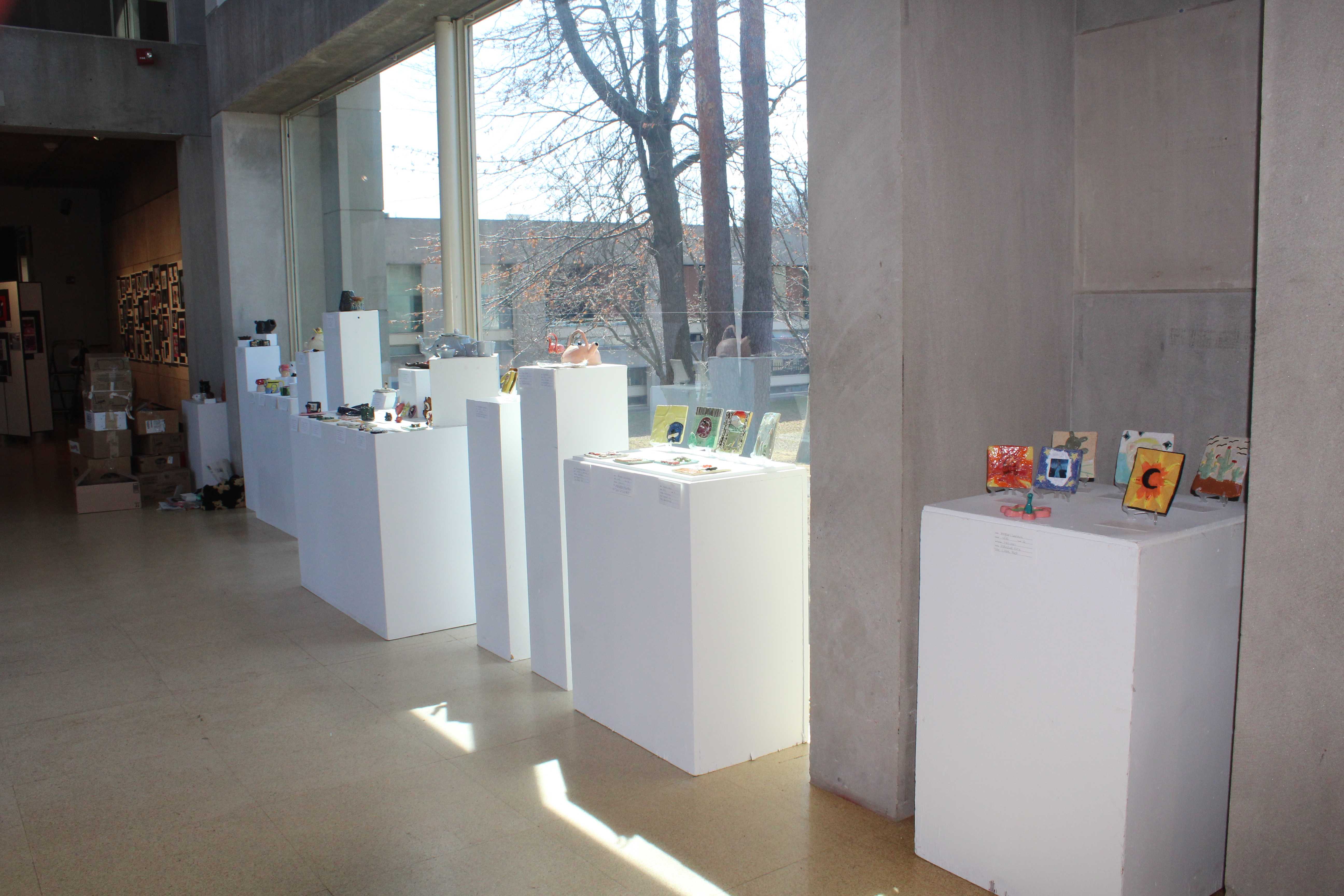 Student pottery on display in the gallery